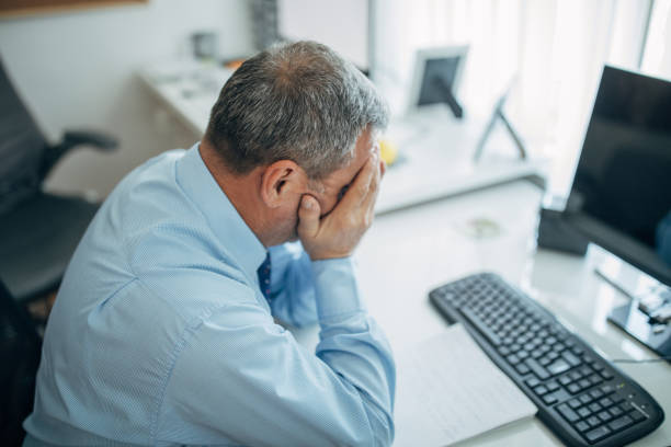 istock Mature businessman works in the office 1150500013