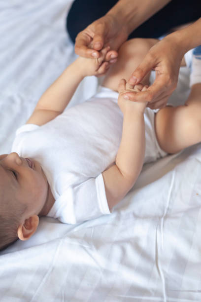 istock Angry 6 months baby boy crying in bed 1150501578