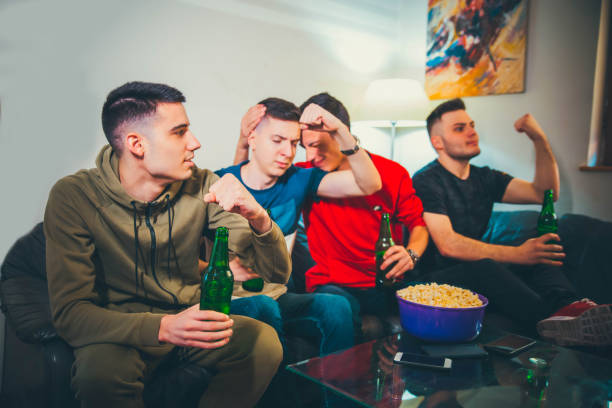 istock Young men watching sports game 1150502018