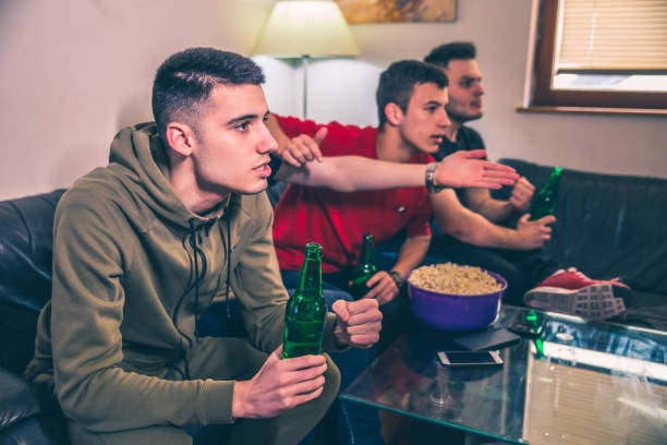 istock Young men watching sports game 1150502058