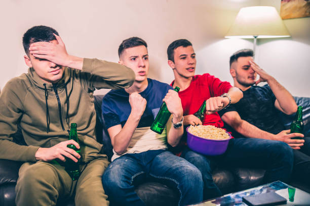 istock Young men watching sports game 1150502109