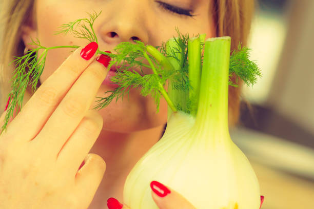 istock Woman holding fennel bulb 1150502427