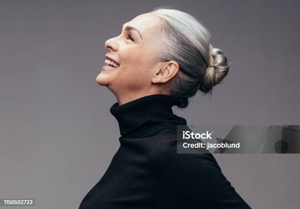 Senior Woman Looking Happy Stock Photo - Download Image Now - Women, Mature Women, One Woman Only