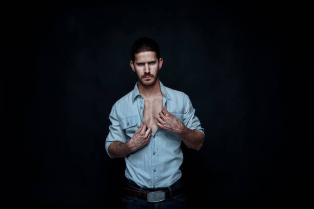 istock Sexy cowboy undressing 1150503755