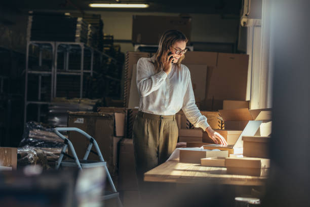 istock Online seller confirming orders 1150504211