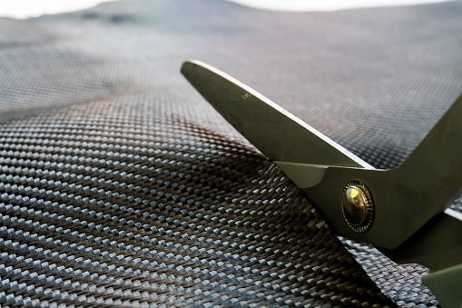 Cutting carbon fiber woven material by Scissors