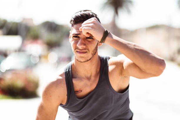 istock muscle man tired after jogging 1150507654