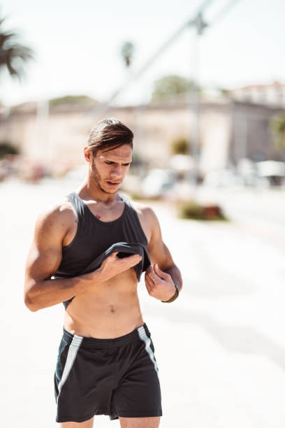 istock muscle man tired after jogging 1150507864