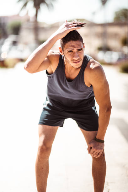 istock muscle man tired after jogging 1150507917
