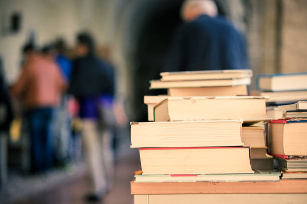 istock Stack of books at a charity book flea market, text space 1150509114
