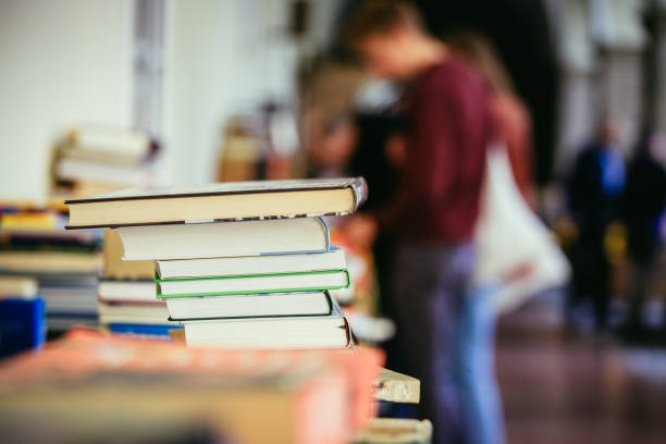istock Stack of books at a charity book flea market, text space 1150509233