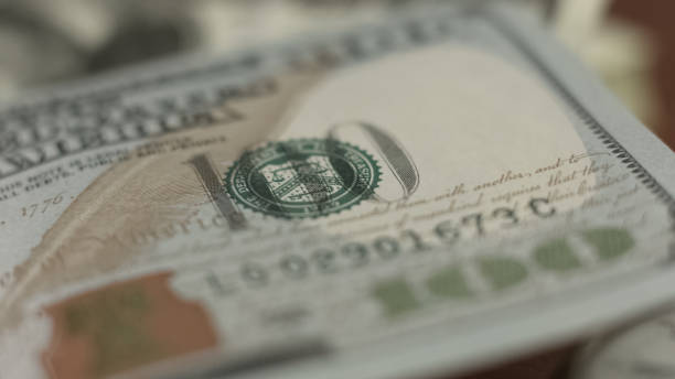 istock Counterfeit money detection, one hundred dollar bill closeup, banking concept 1150511798