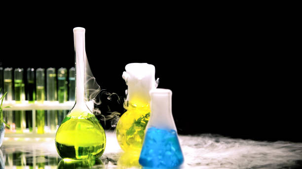 istock Lab flasks with chemical substances emitting smoke, experiments and innovations 1150512508