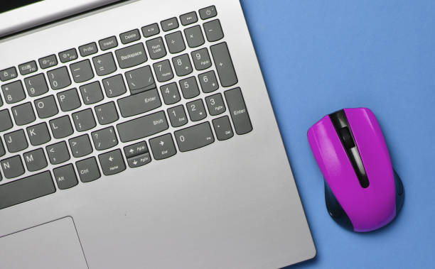 istock Modern laptop, wireless mouse, minimalism, top view, flat lay 1150512573