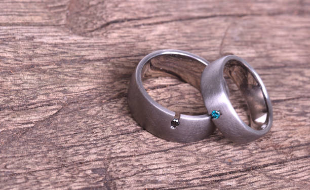 istock Wedding rings on old wood 1150512650