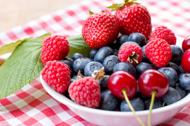 istock Forest berry, healty organic fruit in bowl closeup 1150513375