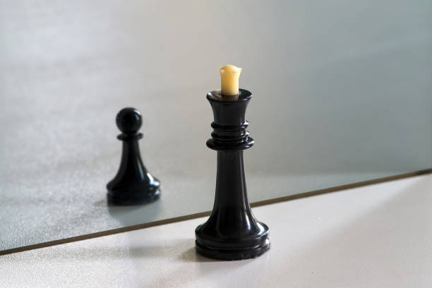 istock Chess in mirror image, concept search opportunities, self-development, improvement, struggle between good and evil,  struggle opposites, search solutions, split personality, human resource management. 1150514477