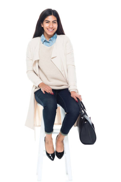 istock Attractive young latino female is sitting 1150517757