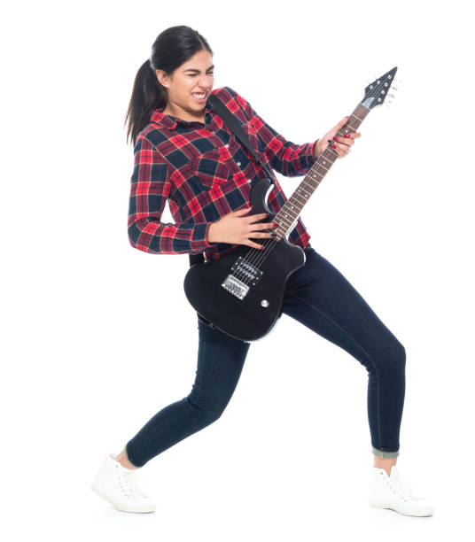 istock Beautiful young latino female playing an electrical guitar 1150517961
