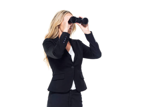 istock Attractive blond businesswoman - is looking into binoculars 1150518509