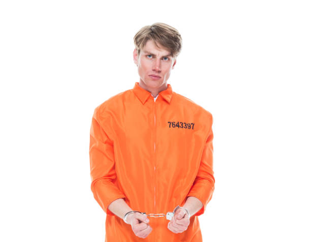 istock Male prisoner wearing handcuffs 1150518544