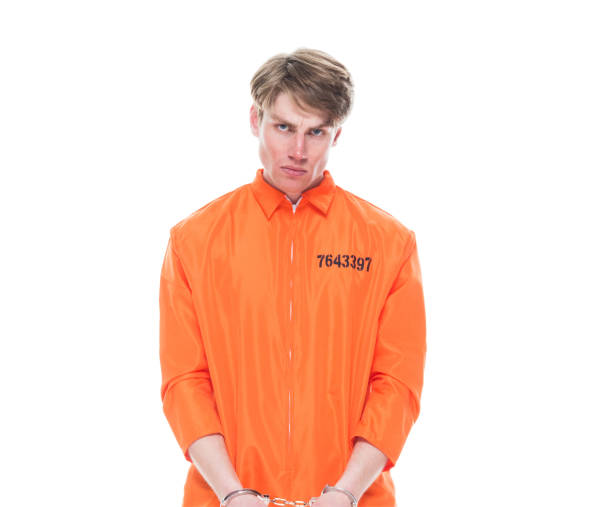istock Male prisoner wearing handcuffs 1150518548