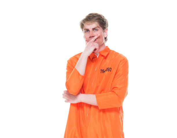 istock Male prisoner wearing orange jumpsuit 1150518586