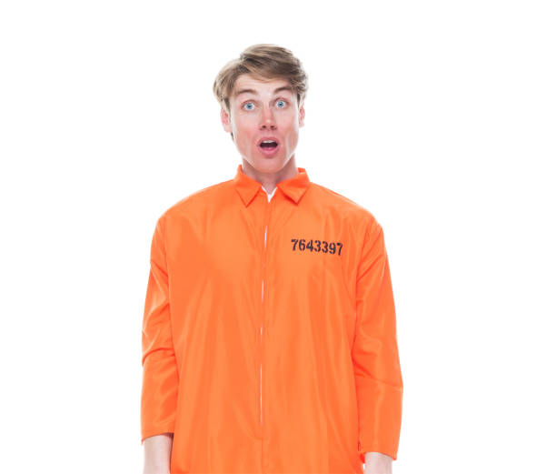 istock Male prisoner wearing orange jumpsuit 1150518627