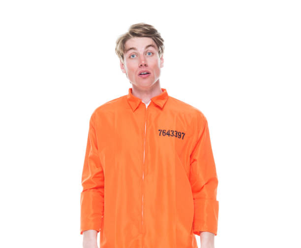 istock Male prisoner wearing orange jumpsuit 1150518665