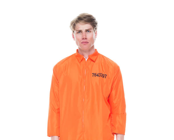 istock Male prisoner wearing orange jumpsuit 1150518672