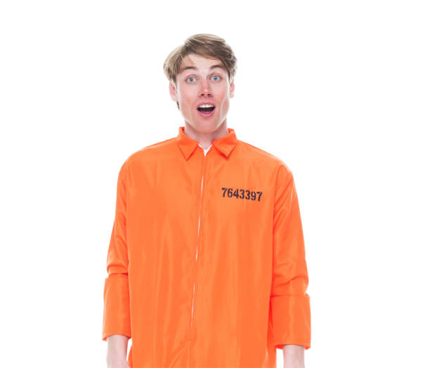 istock Male prisoner wearing orange jumpsuit 1150518684
