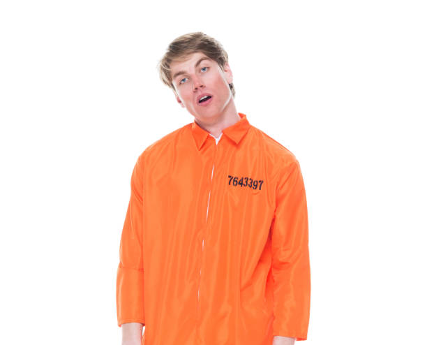 istock Male prisoner wearing orange jumpsuit 1150518713