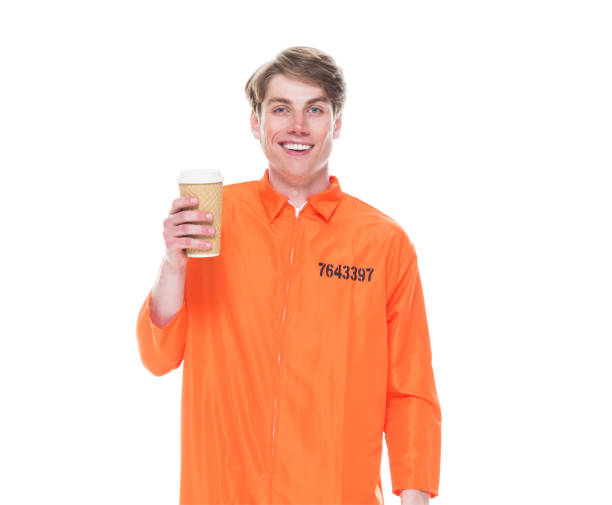 istock Male prisoner wearing orange jumpsuit 1150518720