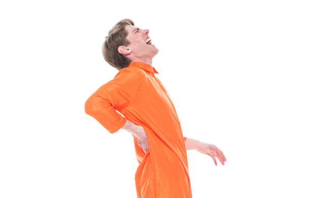 istock Male prisoner wearing orange jumpsuit 1150518726