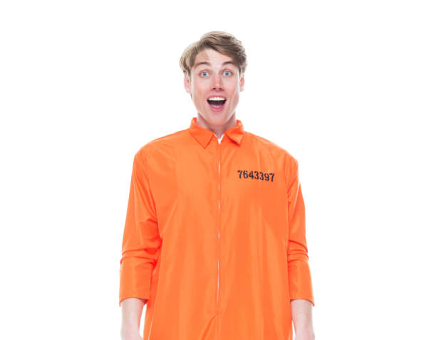 istock Male prisoner wearing orange jumpsuit 1150518746