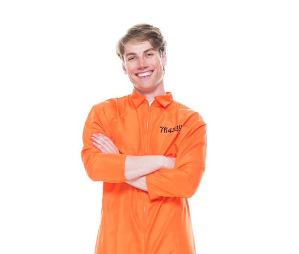 istock Male prisoner wearing orange jumpsuit 1150518765