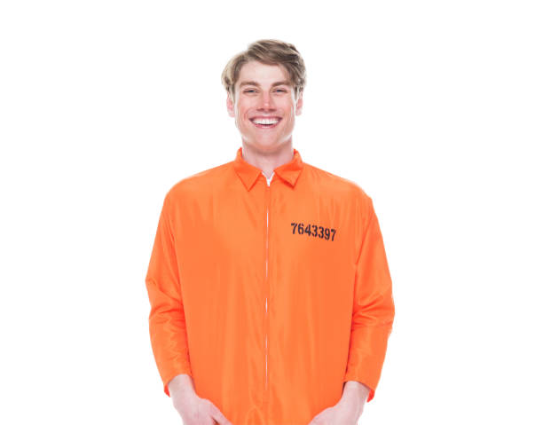 istock Male prisoner wearing orange jumpsuit 1150518787