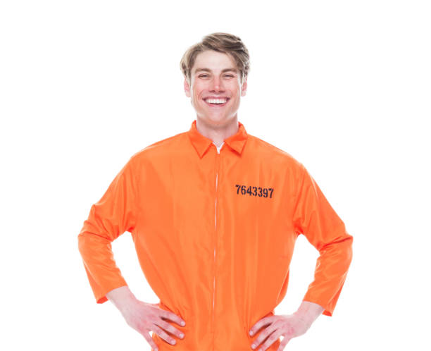 istock Male prisoner wearing orange jumpsuit 1150518792