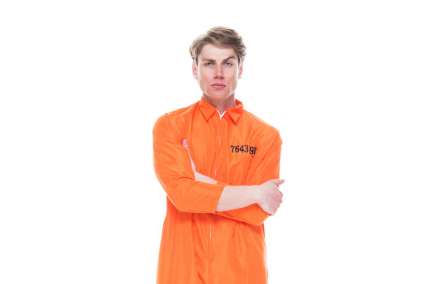 istock Male prisoner wearing orange jumpsuit 1150518857
