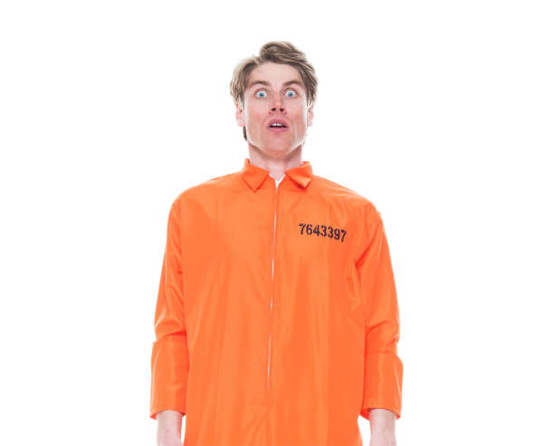 istock Male prisoner wearing orange jumpsuit 1150518876