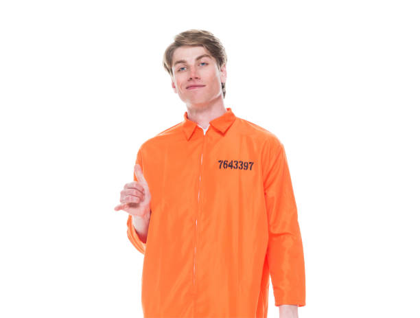istock Male prisoner wearing orange jumpsuit 1150518899