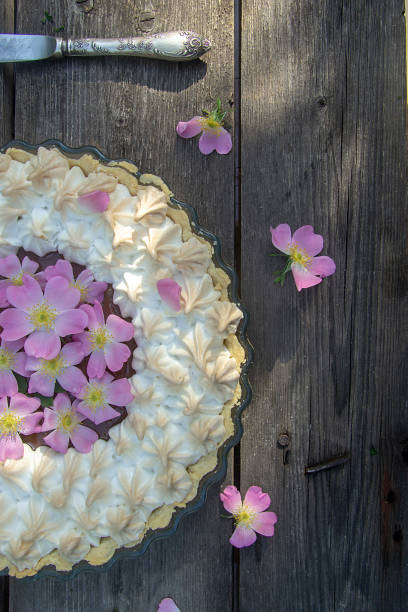 istock meringue tart decorated with rosehip flowers 1150520400