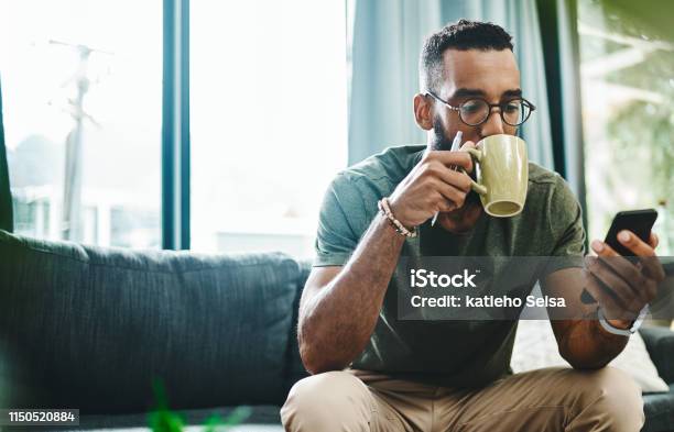 Whats The Vibe On The Newsfeed Stock Photo - Download Image Now - Men, Coffee - Drink, Domestic Life