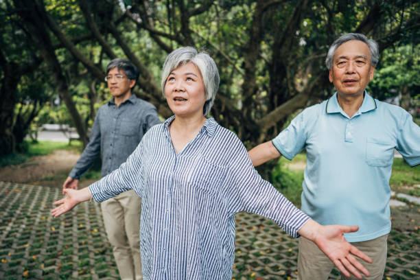 istock Tai Chi class in public park 1150522317
