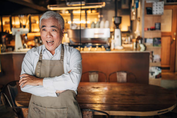 istock Senior man standing in cafe 1150522976