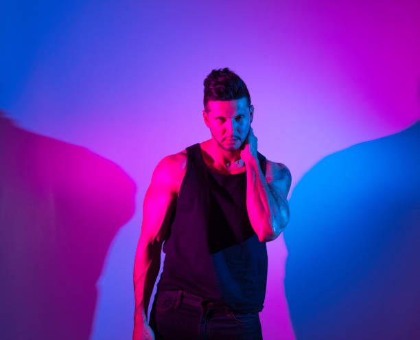 istock Handsome latino man in front of colorful wall 1150524240