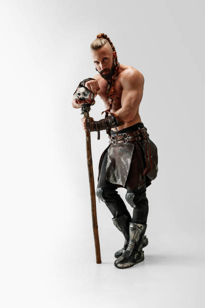 istock Man in leather viking's costume isolated on white studio background 1150525835