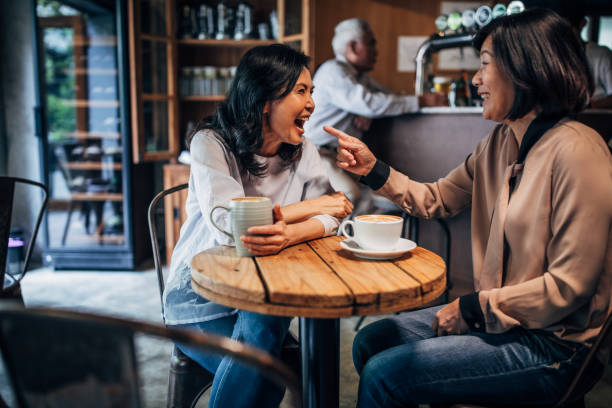 istock Friends drinking coffee in cafe 1150525841