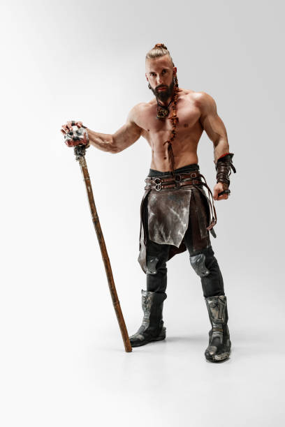 istock Man in leather viking's costume isolated on white studio background 1150525860