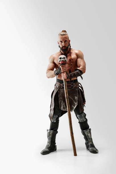 istock Man in leather viking's costume isolated on white studio background 1150525861